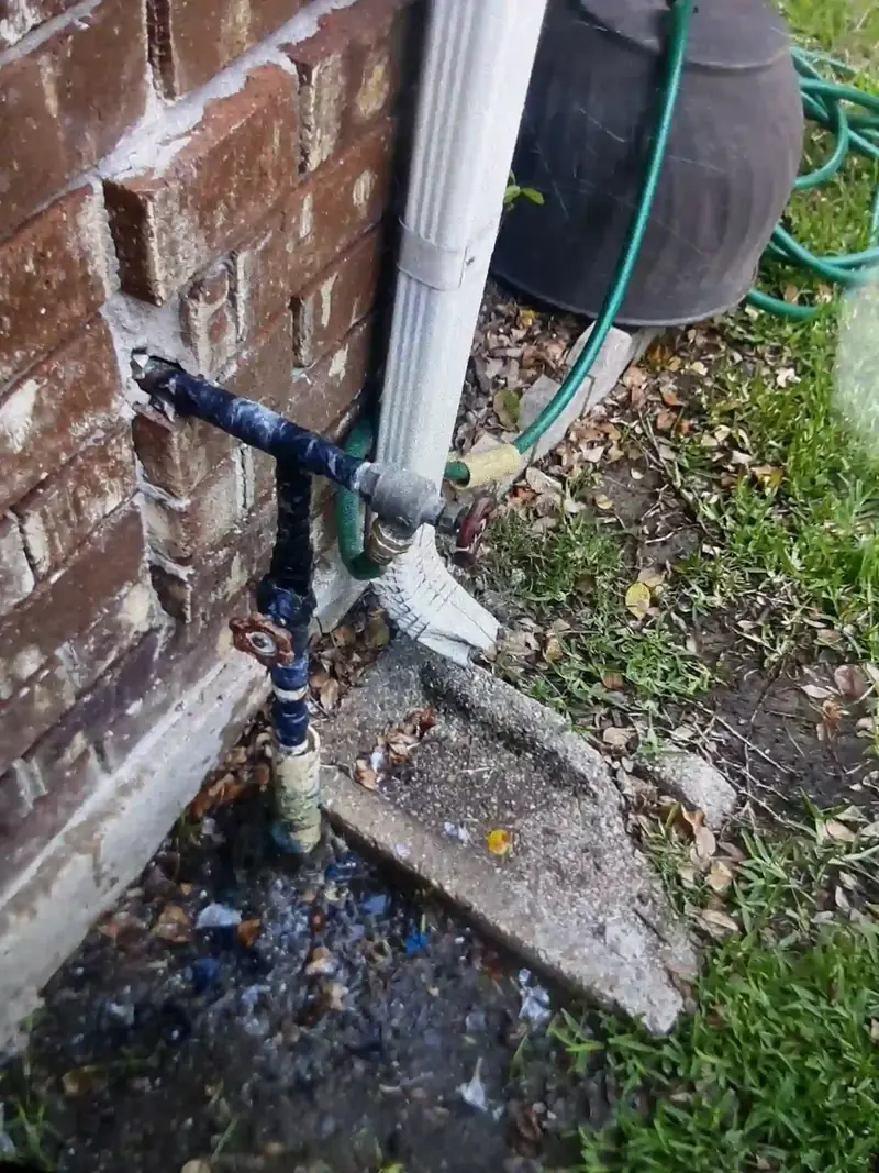 A corroded exterior hose bibb being replaced at a Houston home