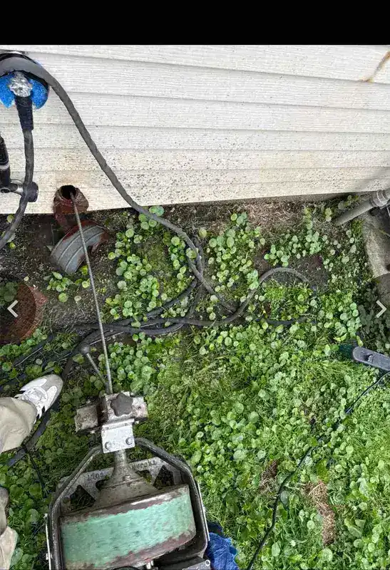 Drain machine cabling out a clogged sink line at a Houston home