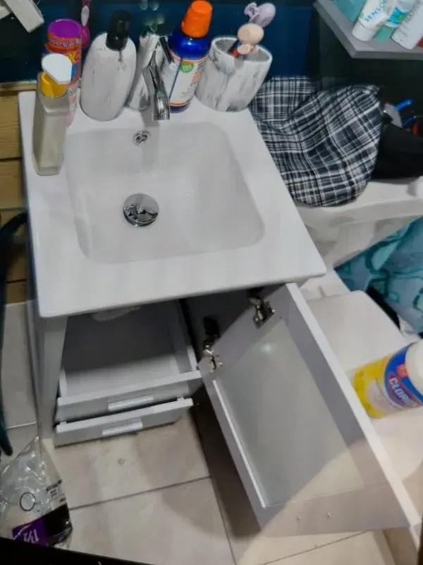 A new vanity sink with the P-trap ready to be reconnected in Houston