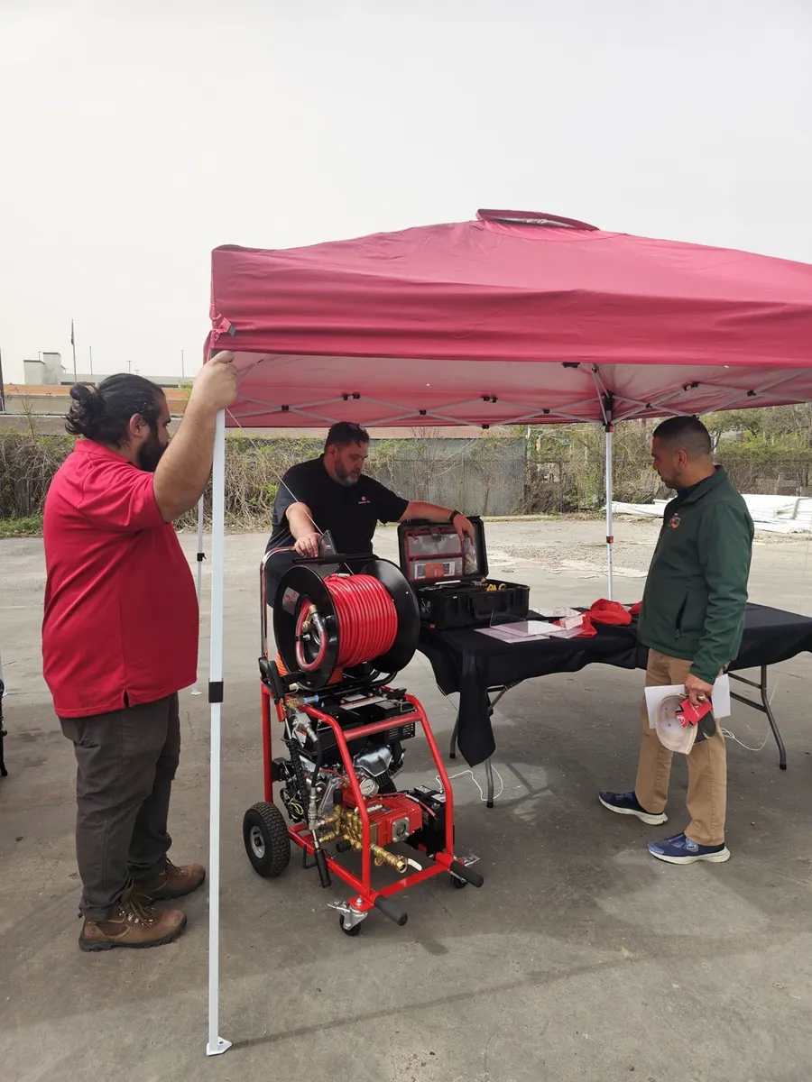 Texas Quality plumbers training on hydro-jetting drain equipment