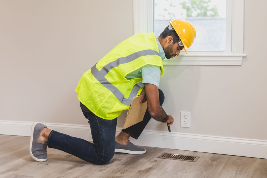 Gas Line Repair & Installation 10 professional plumber inspecting residential gas line in Houston home