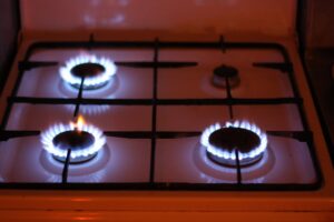 modern kitchen gas stove with a clean blue flame